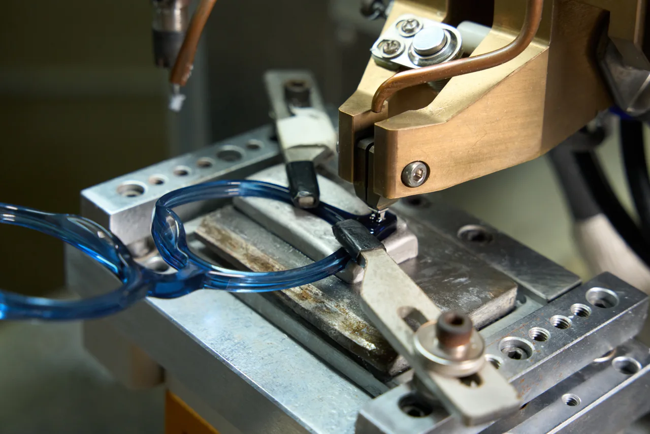 Installing a hinge in a blue acetate front.