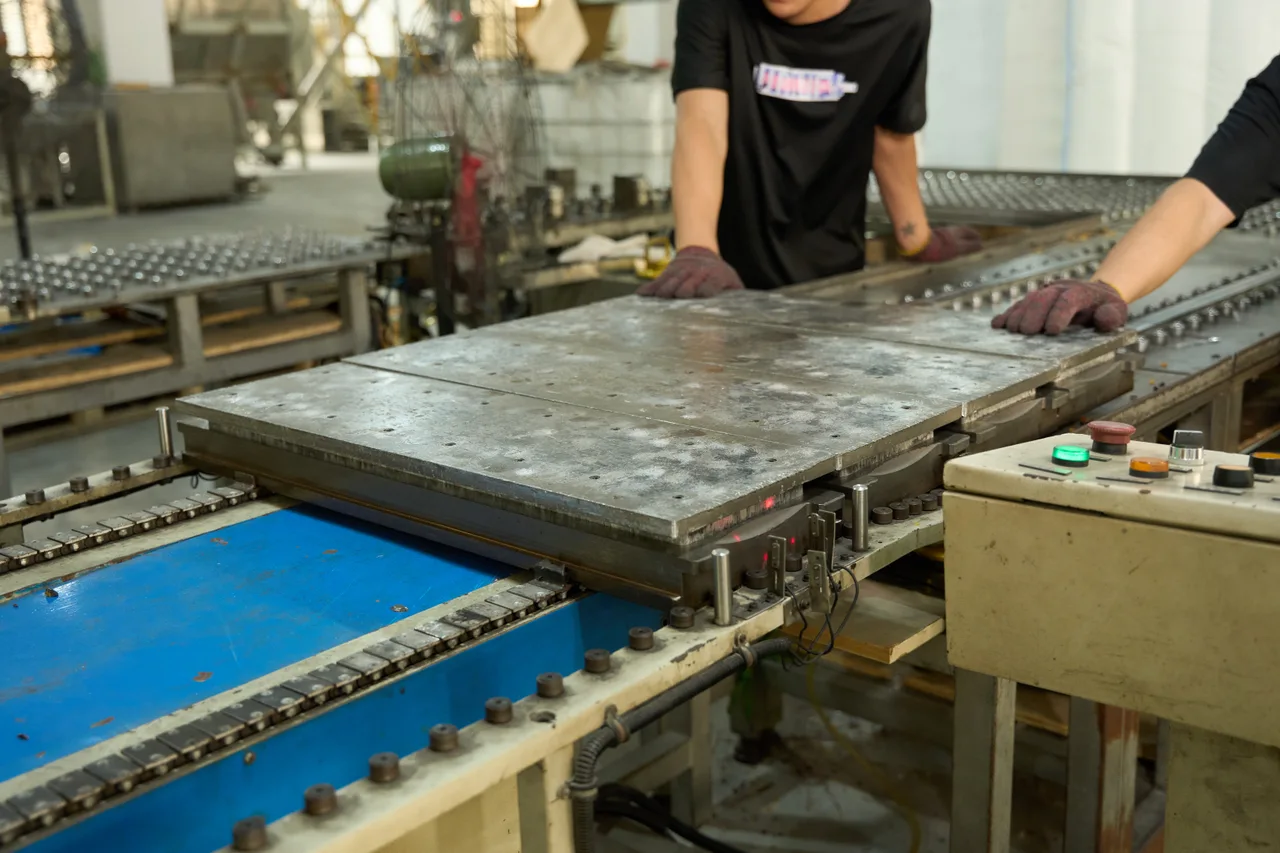 Metal press plates during sheet production.