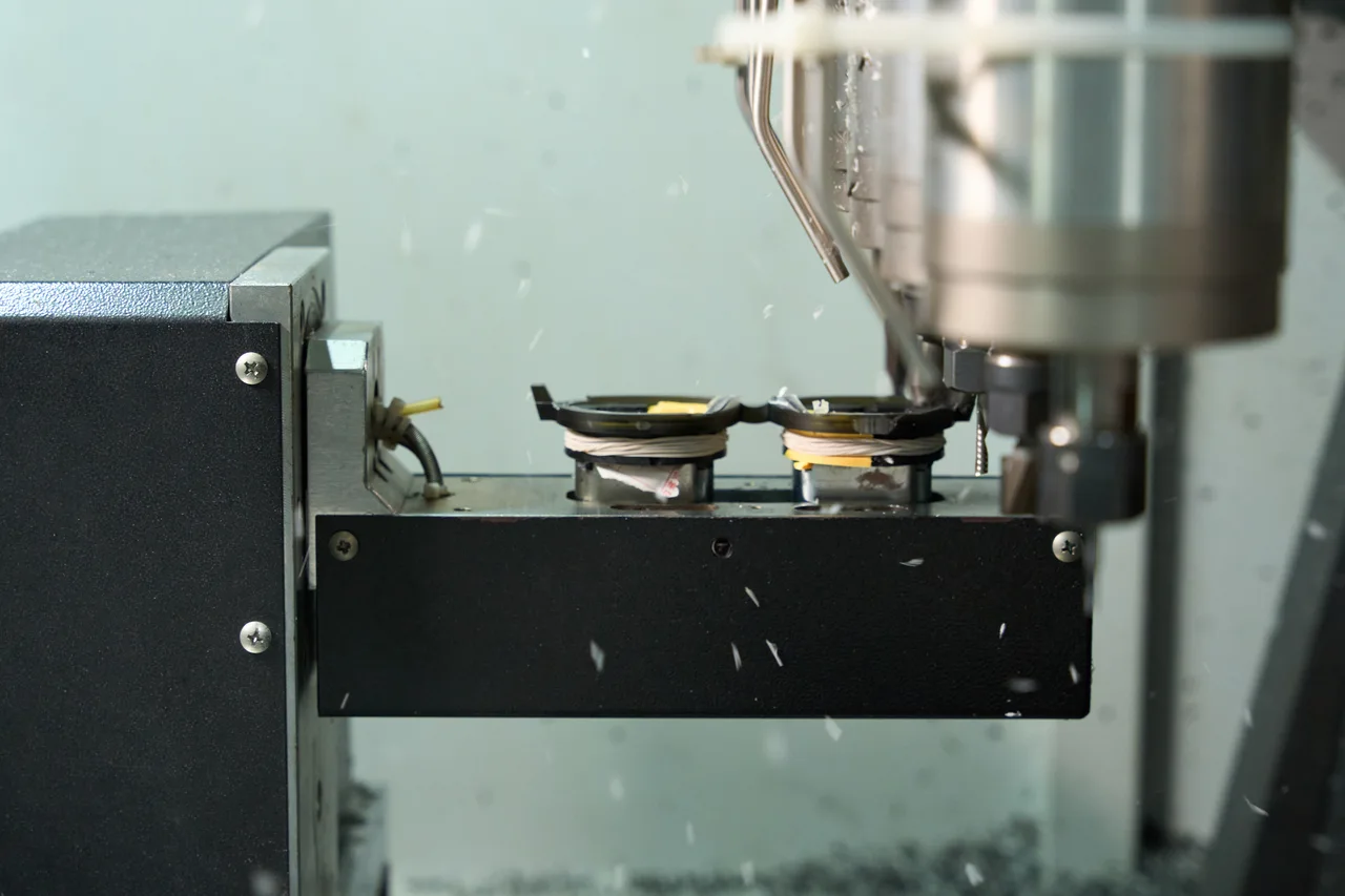 CNC machining of an acetate frame front.