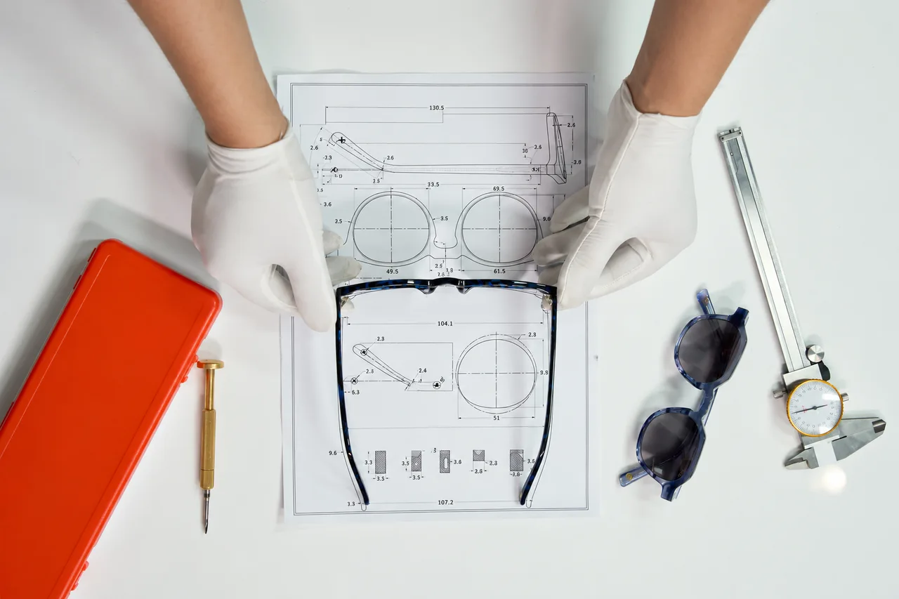 Checking the frame against a technical drawing.