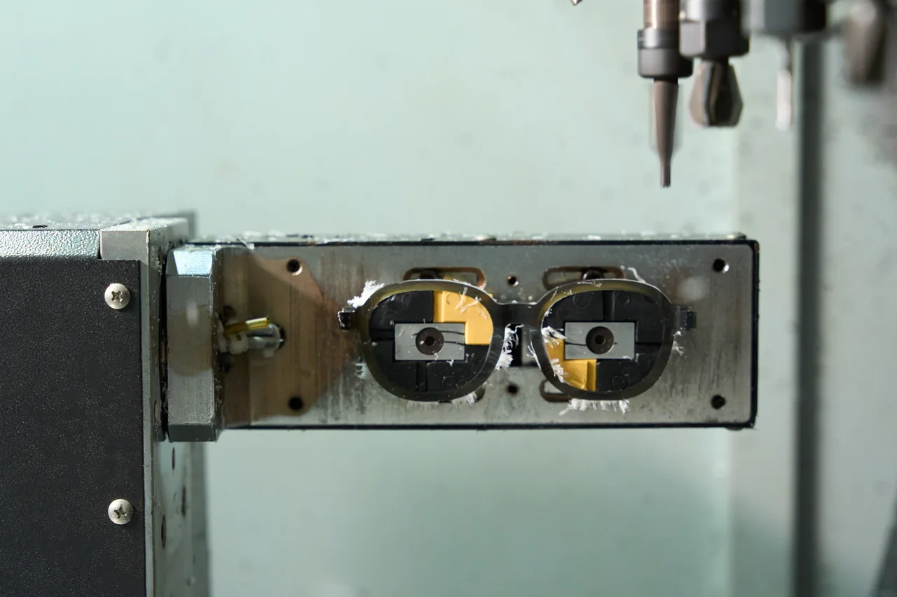 A machined front, still surrounded by cutting chips.