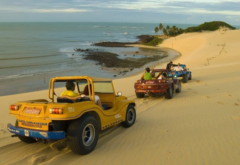 Genipabu dunes and coast with dune buggies, used as the Natal colour reference