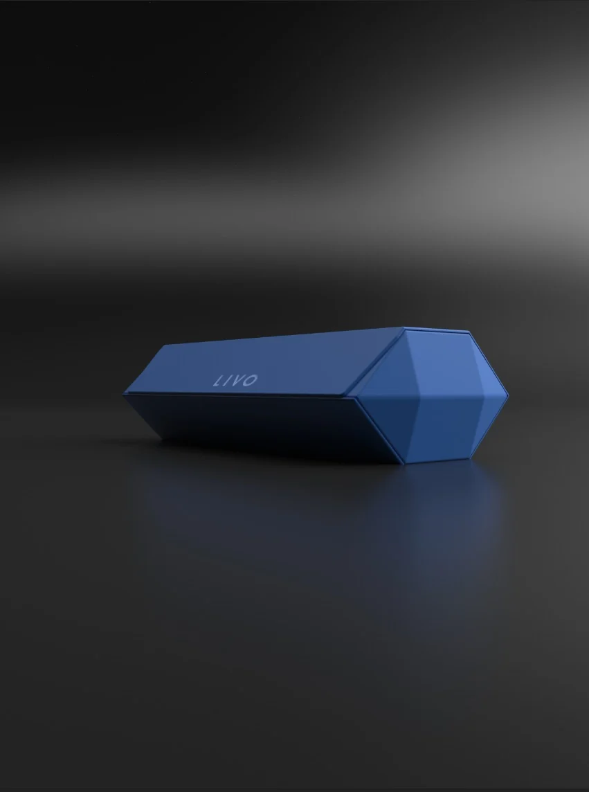 Product rendering of the blue LIVO case, with faceted sides and a hexagonal end, on a dark surface