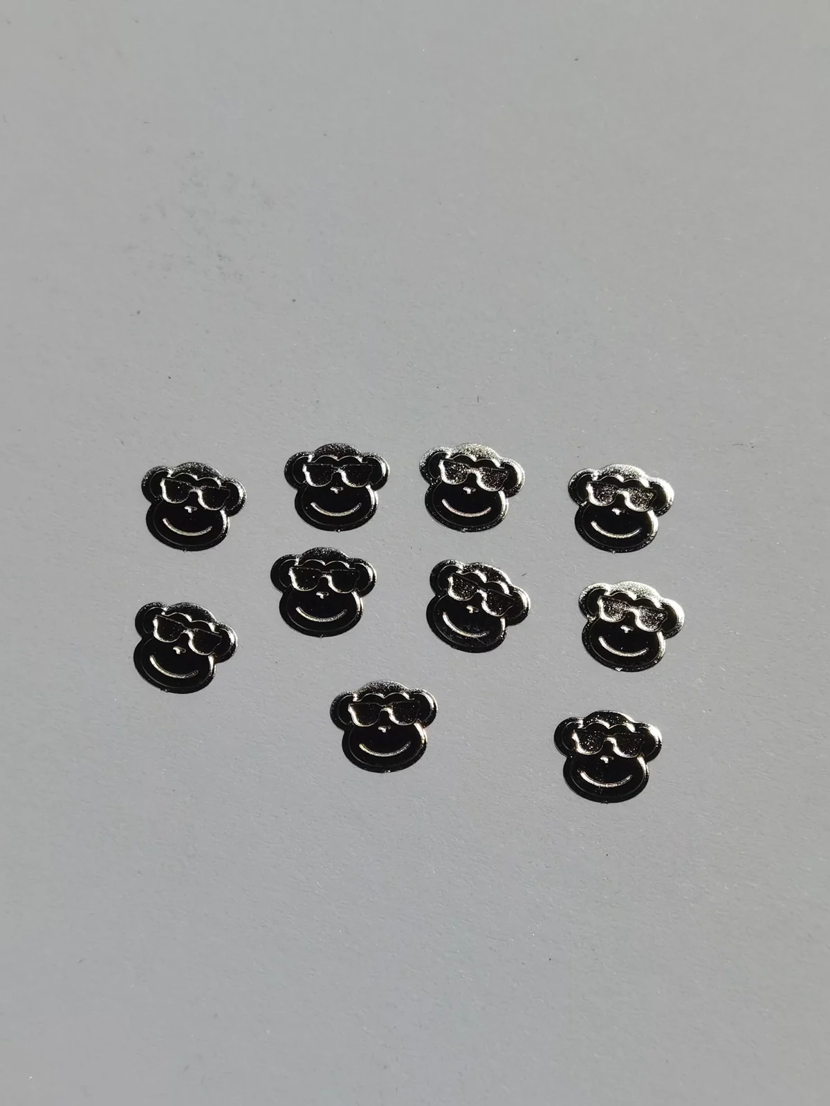 Small monkey emblems from the eyewear development archive