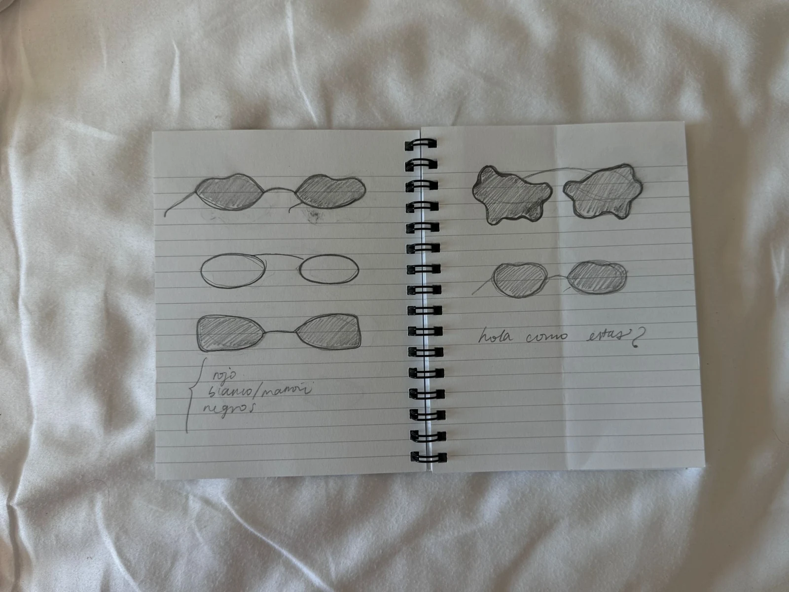 Camila’s original notebook with quick pencil sketches exploring organic sunglasses shapes